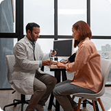 Male and female doctors in discussion